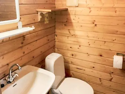 a bathroom with a white toilet and a sink at 4 person holiday home in Eresfjord-By Traum in Øverås