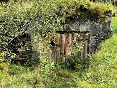an old building in the middle of a grassy field at 5 person holiday home in Brekke-By Traum in Dingja