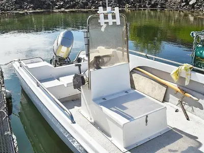 a dog sitting on a boat in the water at 6 person holiday home in Farstad-By Traum in Farstad