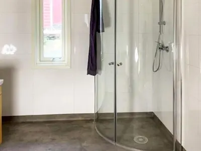 a shower with a glass door in a bathroom at 6 person holiday home in Svelgen-By Traum in Sørgulen