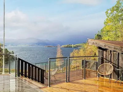 a balcony with a view of the water at 4 person holiday home in Øydegard-By Traum in Torvikbukt