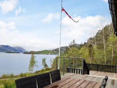 a view of a lake from the deck of a house at 4 person holiday home in Øydegard-By Traum in Torvikbukt