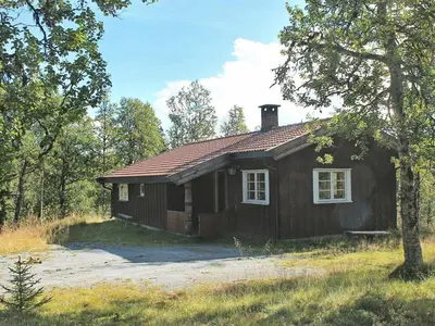 a small wooden house in the middle of a field at 6 person holiday home in NESBYEN-By Traum in Nesbyen