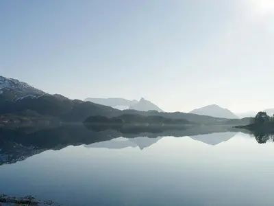 a view of a lake with mountains in the background at 9 person holiday home in GURSKØY-By Traum in Kjellsund