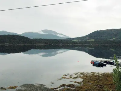 a view of a lake with mountains in the background at 4 person holiday home in VÅGLAND-By Traum in Rabben