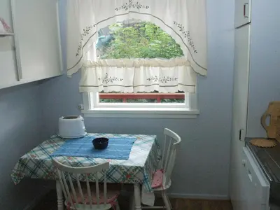 a table and a window with a table and chairs at 4 person holiday home in VÅGLAND-By Traum in Rabben