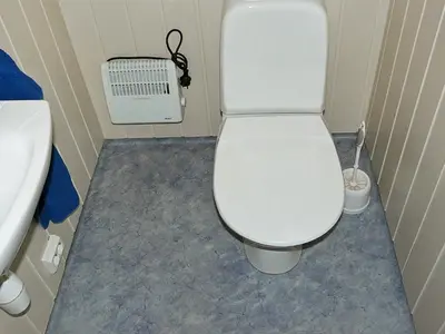 a bathroom with a white toilet and a sink at 4 person holiday home in Lauvstad-By Traum in Lauvstad
