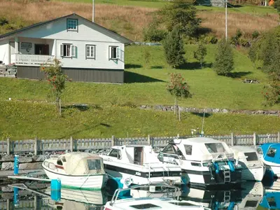 a group of boats are docked in a harbor at 4 person holiday home in Lauvstad-By Traum in Lauvstad