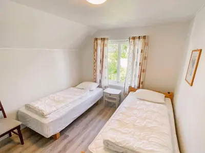 a bedroom with two beds and a window at 11 person holiday home in VEVANG-By Traum in Vevang