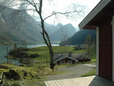 a house with a view of a lake and mountains at 4 person holiday home in olden-By Traum in Olden