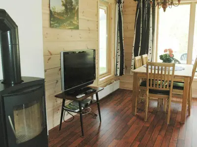 a living room with a television and a table with a tableablish at 4 person holiday home in olden-By Traum in Olden
