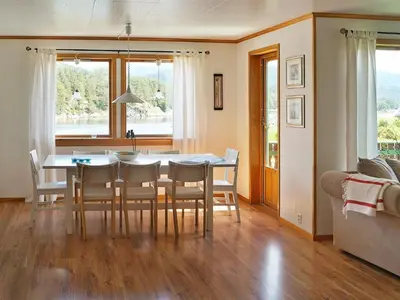 a kitchen and dining room with a table and chairs at 10 person holiday home in HOSTELAND-By Traum in Hosteland