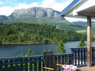 a balcony with a view of a lake and mountains at 10 person holiday home in Bygstad-By Traum in Bygstad