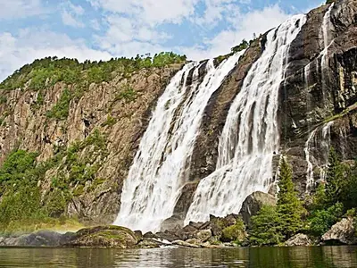 a waterfall on the side of a mountain at 10 person holiday home in Bygstad-By Traum in Bygstad