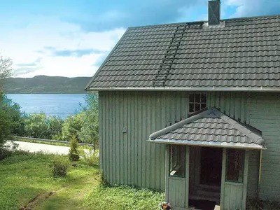 an old green house with a view of the water at 8 person holiday home in Åfarnes-By Traum in Årset