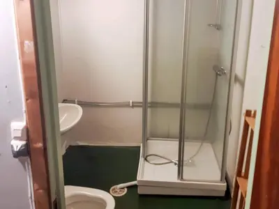 a small bathroom with a shower and a toilet at 8 person holiday home in Åfarnes-By Traum in Årset