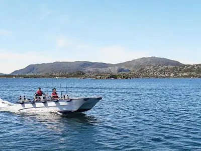 two people on a boat in the water at 8 person holiday home in Kalvåg-By Traum in Kalvåg