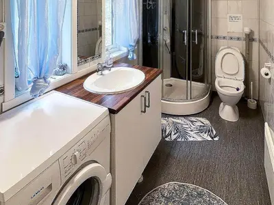 a bathroom with a sink and a toilet at 6 person holiday home in Storfosna-By Traum in Sletta