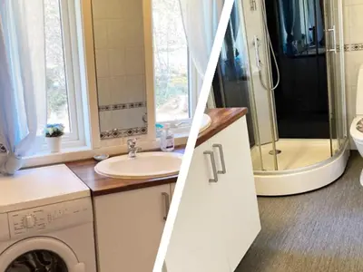 a bathroom with a sink and a washing machine at 6 person holiday home in Storfosna-By Traum in Sletta