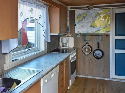 a kitchen with a sink and a counter top at 6 person holiday home in Oksvoll-By Traum in Oksvoll