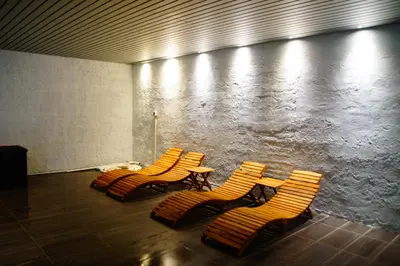 a group of chairs and tables in a room at Oppheim Holiday Apartment in Øyjordi