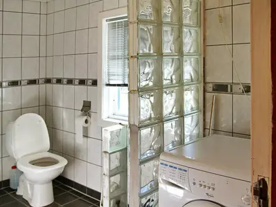 a bathroom with a toilet and a window at 6 person holiday home in Øvre Årdal in Øvre Årdal