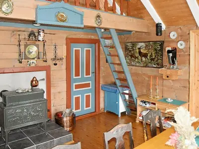 a room with a staircase in a wooden house at 10 person holiday home in Bygstad in Bygstad