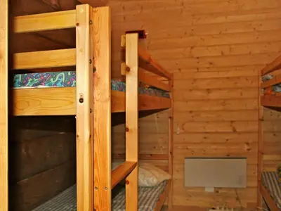 a bedroom with two bunk beds in a cabin at 10 person holiday home in Bygstad in Bygstad