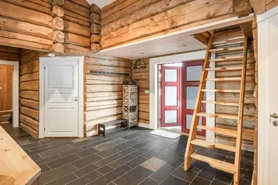 a room with wooden walls and a ladder at Trysilfjellet Nord 356 A and B in Trysil