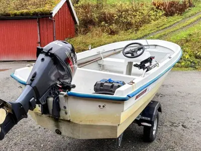 a boat on a trailer with a motor on it at 4 person holiday home in Surna in Glerem