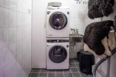 a washer and dryer in a small bathroom at Trysilfjellet Nord 170 in Trysil