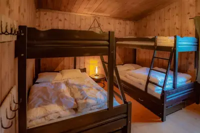 a room with two bunk beds in a cabin at Trysilfjellet Nord 170 in Trysil