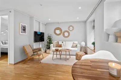 a living room with a couch and a table at Charming apartment 200m from Bryggen in Bergen