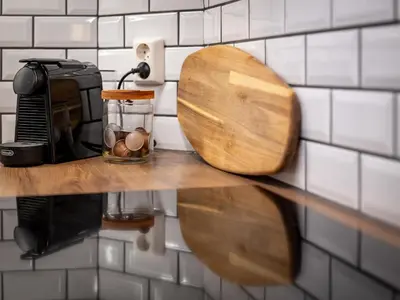 a counter with a wooden toilet seat on a wall at Charming apartment 200m from Bryggen in Bergen