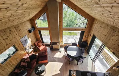 an overhead view of a living room in a log cabin at Cozy Home In Rauland With Sauna in Rauland