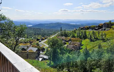 a view of a village with trees and a road at Cozy Home In Rauland With Sauna in Rauland
