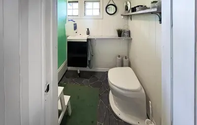 a small bathroom with a toilet and a sink at Cozy Home In Vinje With Wifi in Hommo
