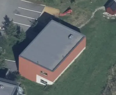 an overhead view of a building with a gray roof at Hybelleilighet 4 pers ski-VM 2025 in Trondheim