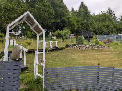 a garden with a gazebo in a field at Apartment Fjordblick in Leikanger