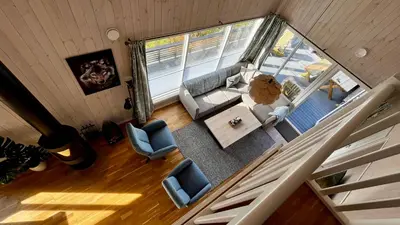 an overhead view of a living room with a couch and chairs at Modern cabin, great view, sunny, 2BA, 4BR in Hemsedal