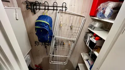 a backpack hanging from a rack in a refrigerator at Modern cabin, great view, sunny, 2BA, 4BR in Hemsedal