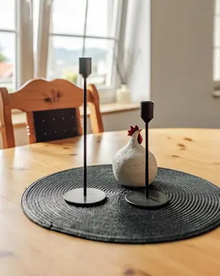 a table with two candles on top of a table at Vestre apartment in Ålesund