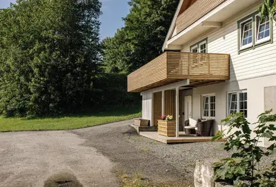 a deck on the side of a house at Vestre apartment in Ålesund