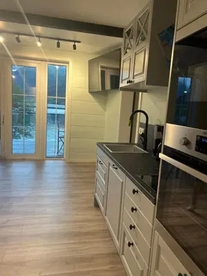 a kitchen with a sink and a counter top at Husslåttene apartments with terrace in Skei