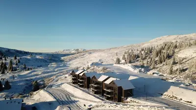 an aerial view of a resort in the snow at Storefjell Resort - Panorama apartments in Gol