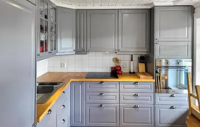 a kitchen with gray cabinets and a sink at Nice Home In Vinje With House Sea View in Trovatn