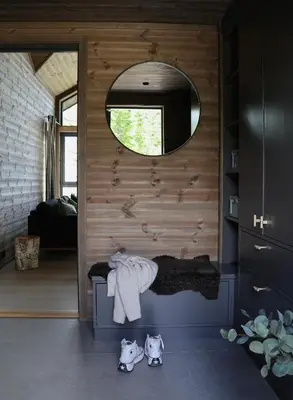 a bathroom with a mirror and a sink in a room at New chalet with great view in Hafjell