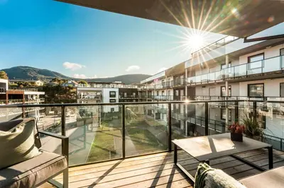 an apartment balcony with a view of a city at Luxury Apartment in Bergen, 10min from City Centre in Bergen