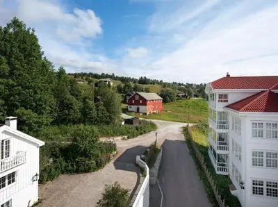 an aerial view of a house and a road at Toppleilighet Dr Holms in Geilo