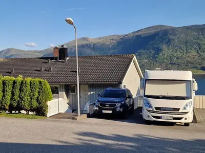 a truck parked in front of a house at Hessahuset in Ålesund